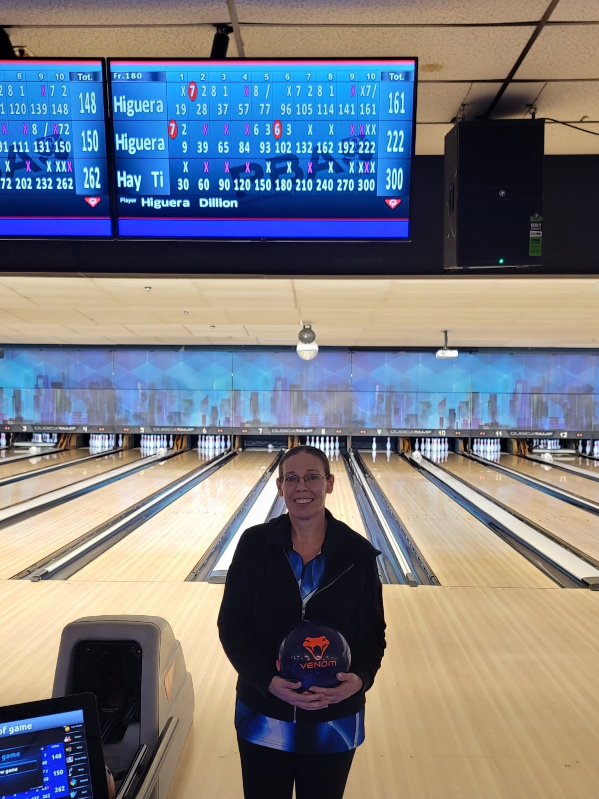 Bowler in front of a scoreboard showing a 300 game